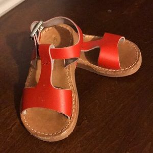 Freshly picked red sandals for baby/toddler